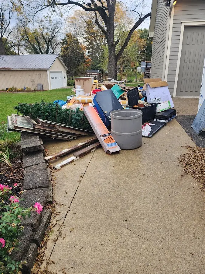 Dumpster being loaded with debris for 30 Yard Dumpster Rental in Seven Corners